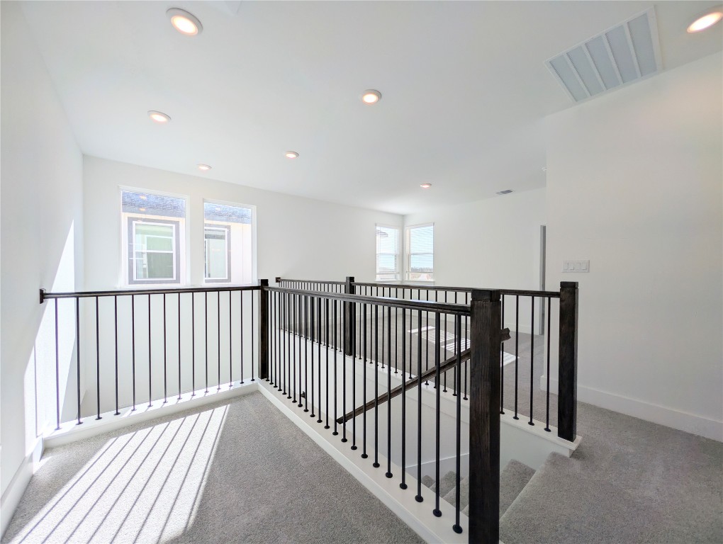 113 Sycamore Pnes Lane Kyle, TX 78640 - Photo 16 of 32 a view of a hallway with windows