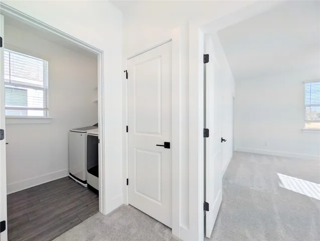 a view of a hallway with windows