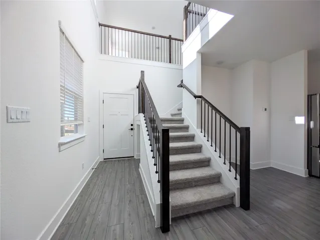 a view of entryway with wooden floor