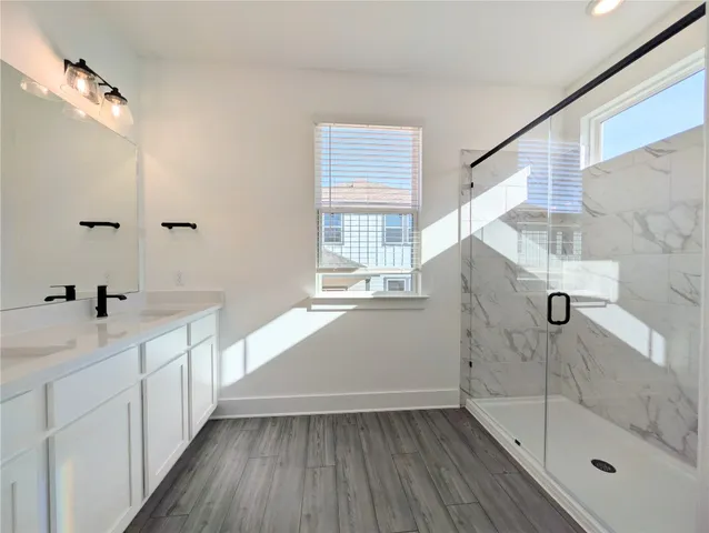 a bathroom with a bathtub and a sink