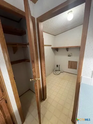 a view of storage and utility room