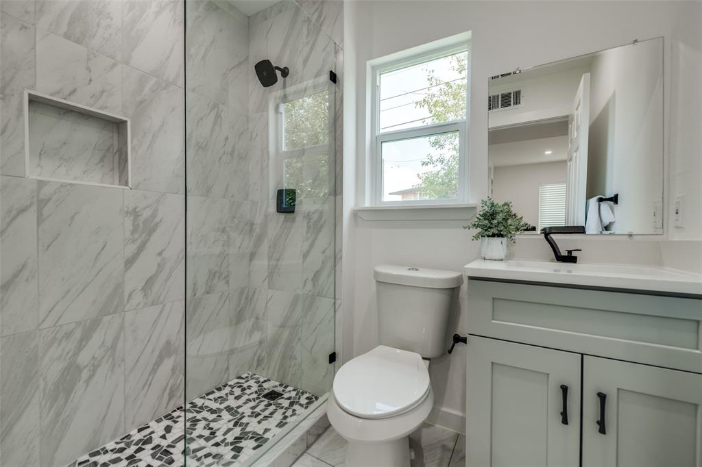 1101 Clayton Lane, Unit C203 Austin, TX 78723 - Photo 4 of 8 Full bath featuring vanity and a marble finish shower