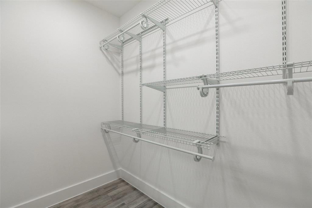 1101 Clayton Lane, Unit C203 Austin, TX 78723 - Photo 7 of 8 Spacious closet with light wood-type flooring