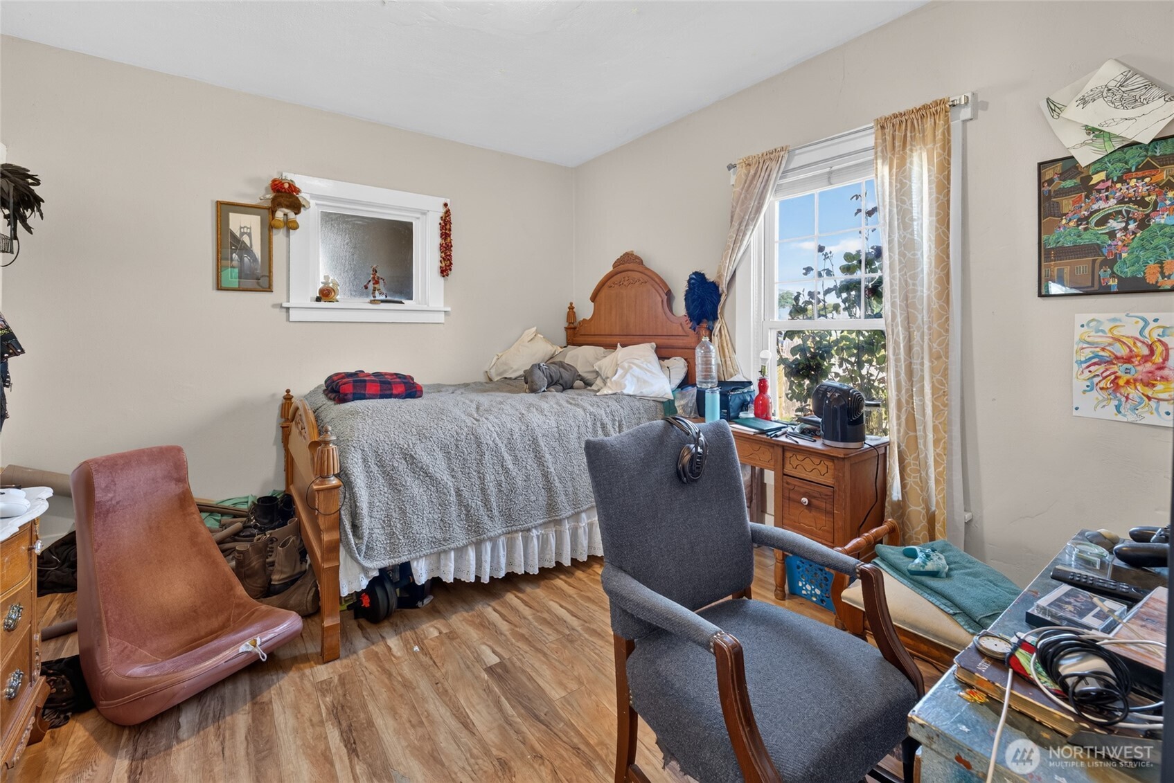 237 West 3rd Street Port Angeles, WA 98362 - Photo 18 of 40 a bedroom with bed and a chair