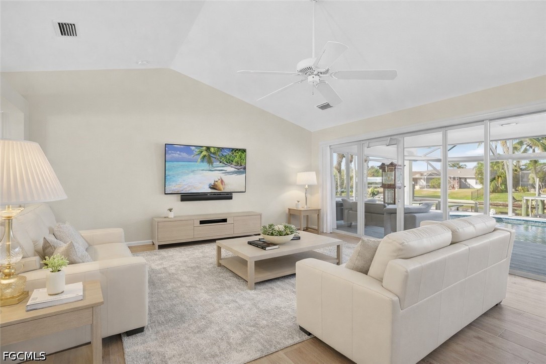 4306 Southwest 3rd Avenue Cape Coral, FL 33914 - Photo 10 of 50 a living room with furniture and a flat screen tv