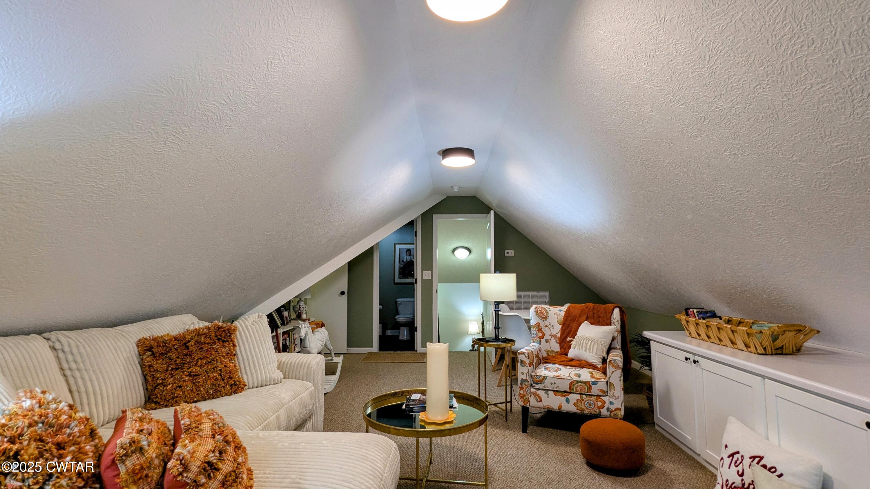255 Ridgewood Drive Henderson, TN 38340 - Photo 19 of 25 a living room with furniture and a potted plant