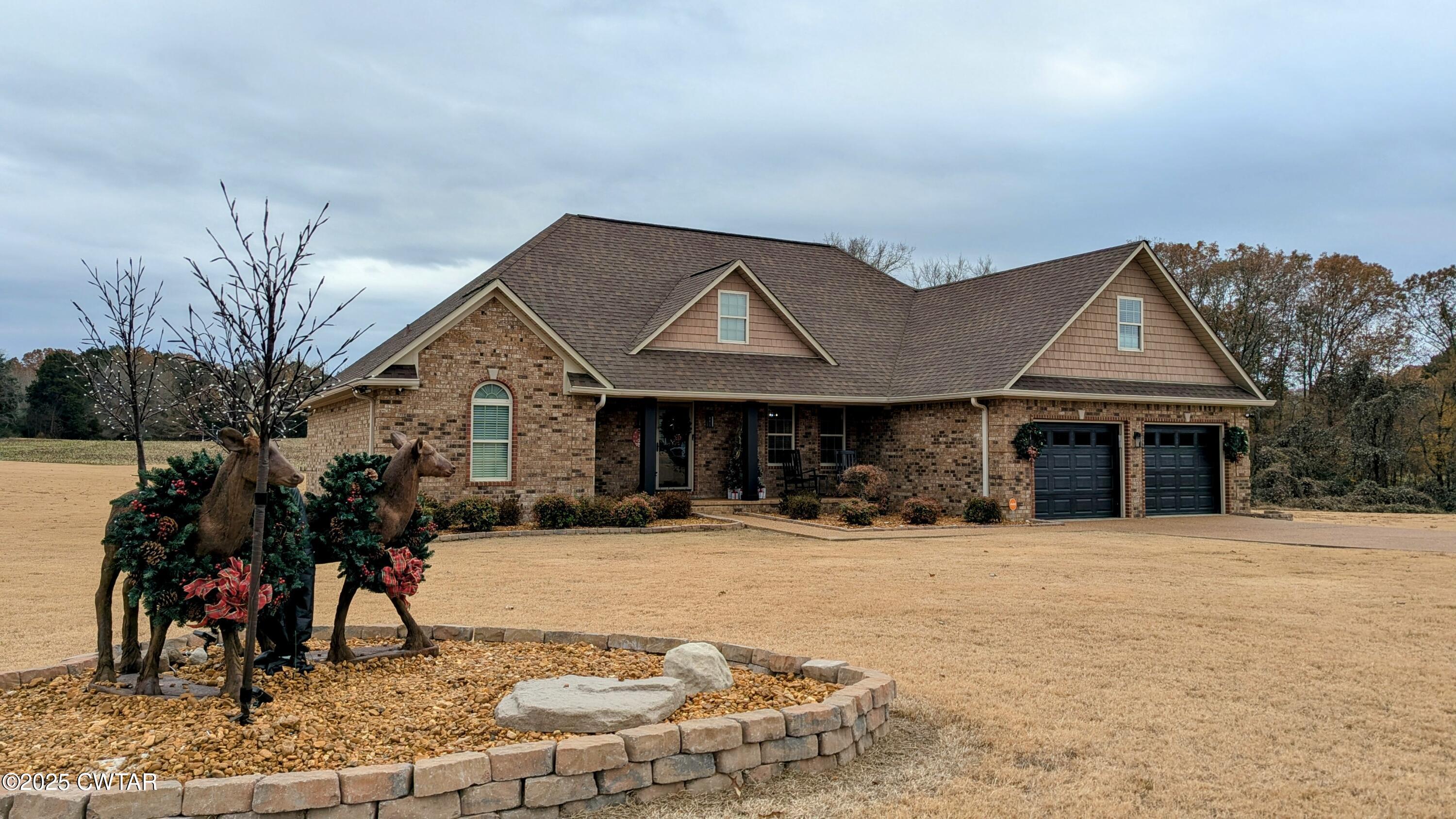 255 Ridgewood Drive Henderson, TN 38340 - Photo 21 of 25 a view of a house with a yard