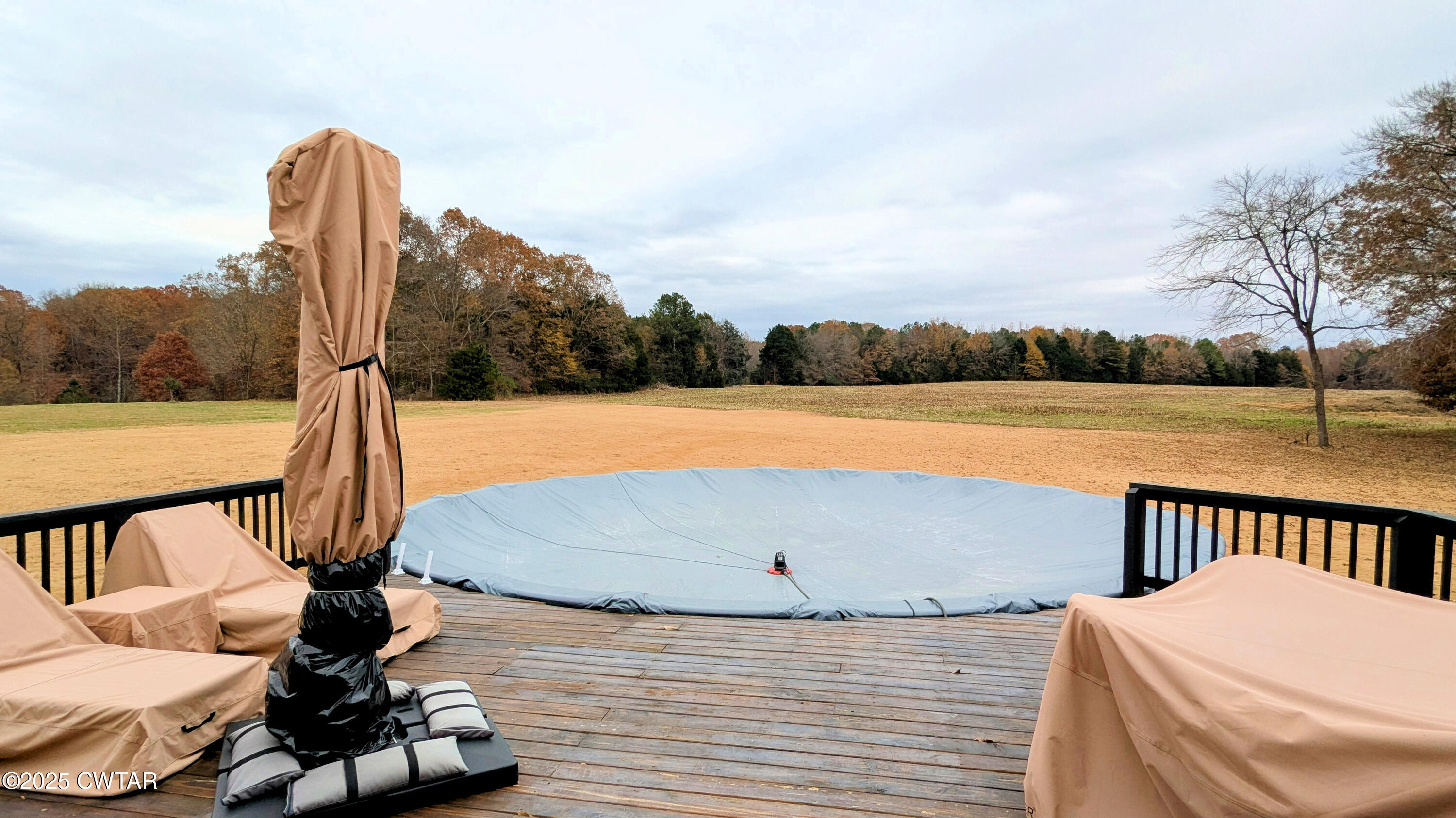 255 Ridgewood Drive Henderson, TN 38340 - Photo 22 of 25 a view of a swimming pool with a deck and a chair