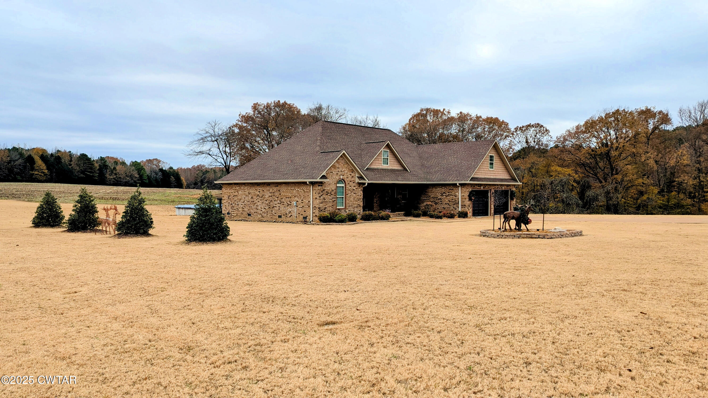 255 Ridgewood Drive Henderson, TN 38340 - Photo 24 of 25 a view of swimming pool with a yard and large trees