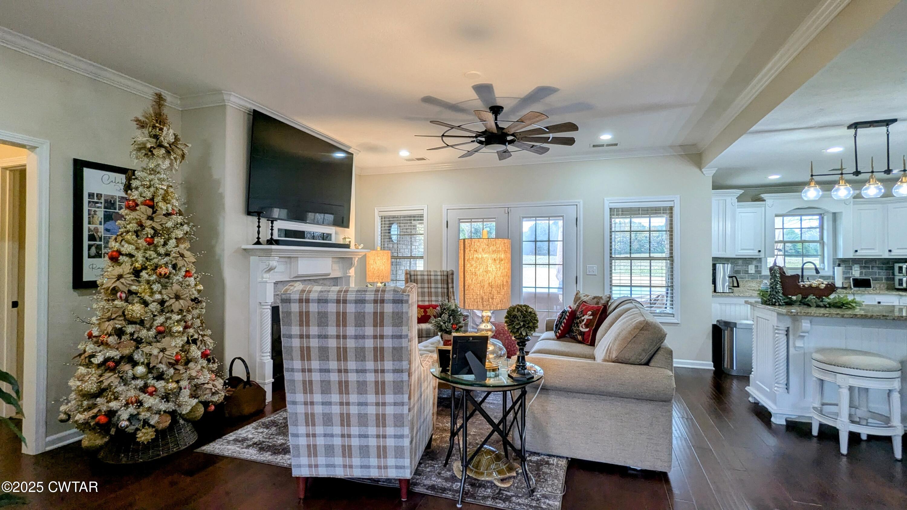 255 Ridgewood Drive Henderson, TN 38340 - Photo 5 of 25 a living room with furniture and a flat screen tv