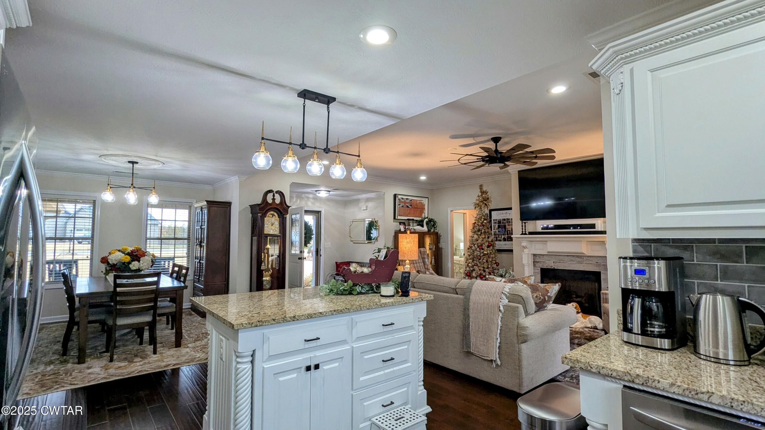 255 Ridgewood Drive Henderson, TN 38340 - Photo 9 of 25 a living room with fireplace furniture and a flat screen tv