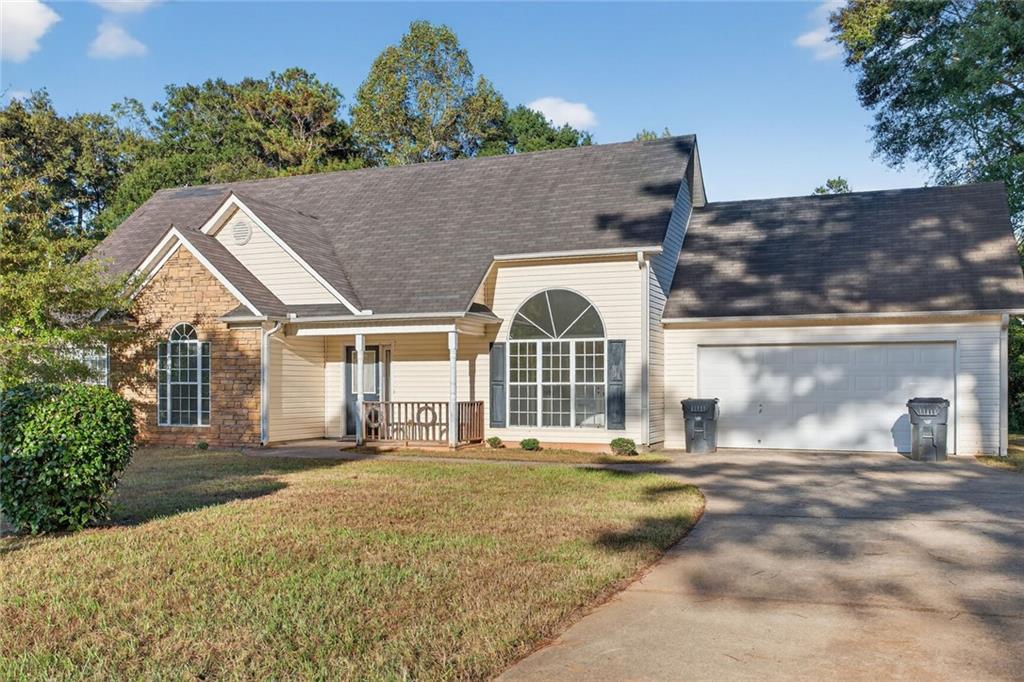 front view of a house with a yard
