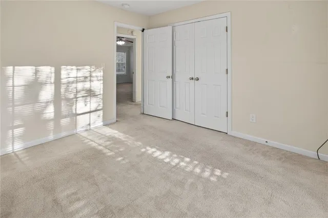 a view of empty room with windows