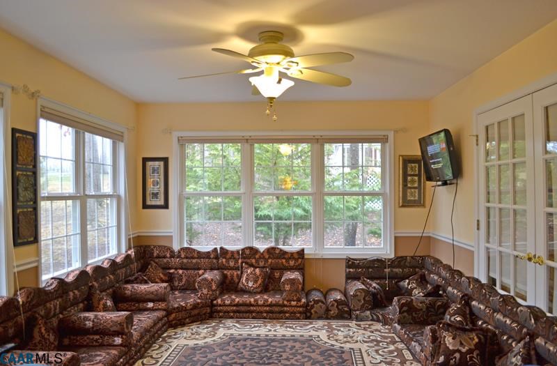 10 Out Of Bounds Road Palmyra, VA 22963 - Photo 13 of 19 a living room with furniture and large windows