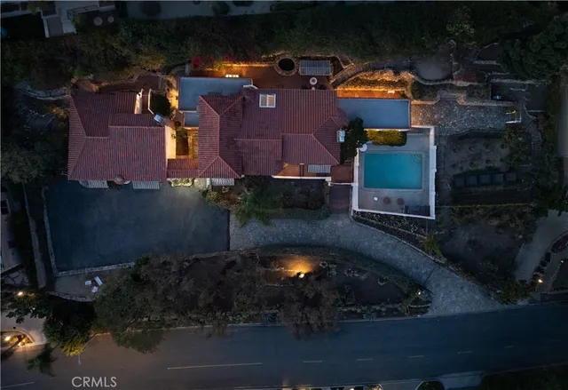 an aerial view of house with yard swimming pool and outdoor seating