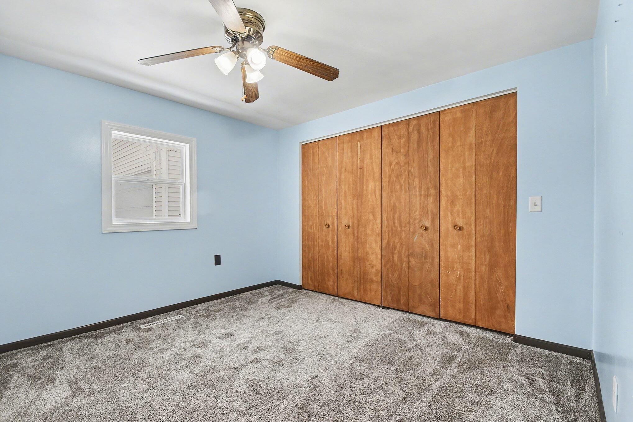 8172 East Emery Road New Carlisle, IN 46552 - Photo 8 of 14 a view of an empty room with a window