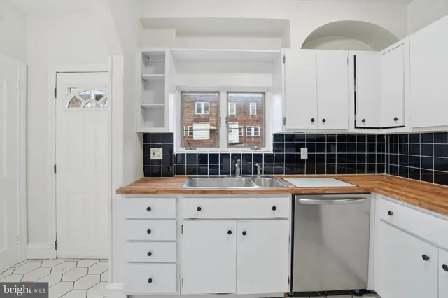 a view of an empty room with windows