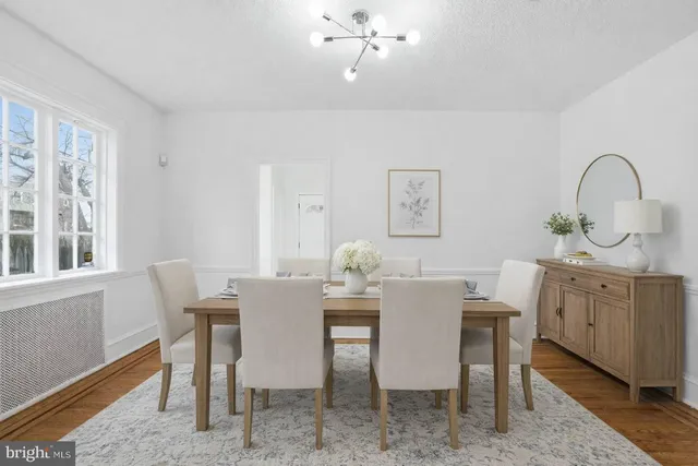 a dining room with furniture and window