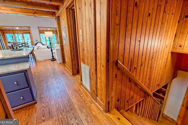 a bedroom with furniture and wooden floor