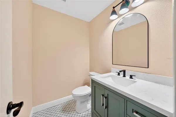 a bathroom with a double vanity sink mirror and