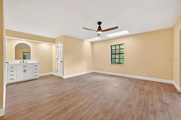 a bathroom with a double vanity sink a mirror and a shower