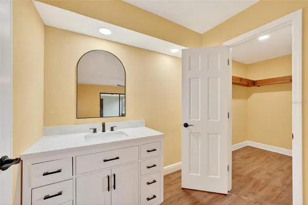 a bathroom with a sink and a mirror