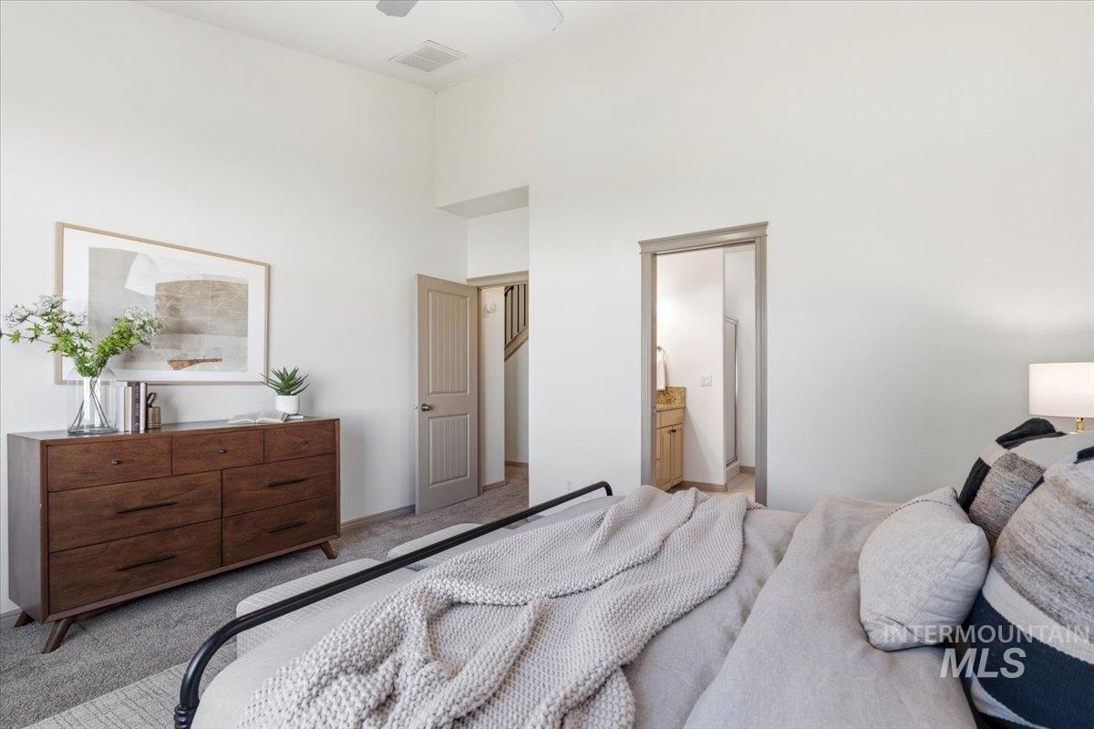 1183 North Buffalo Way Middleton, ID 83644 - Photo 19 of 47 Vaulted ceiling bedroom with neutral carpet flooring and a light color palette