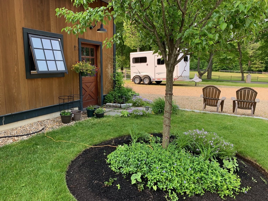 627 Bay Road Hamilton, MA 01982 - Photo 13 of 13 a view of backyard with a garden and plants