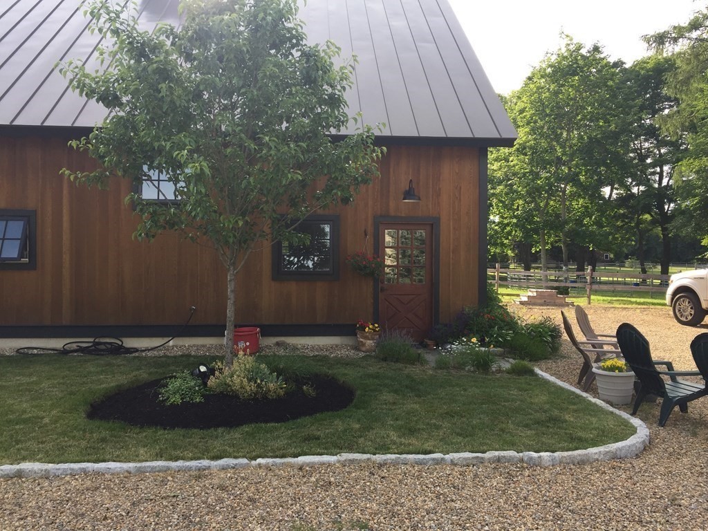 627 Bay Road Hamilton, MA 01982 - Photo 6 of 13 a view of a house with backyard and garden