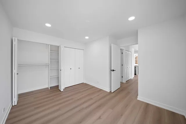 a view of wooden floor in an empty room