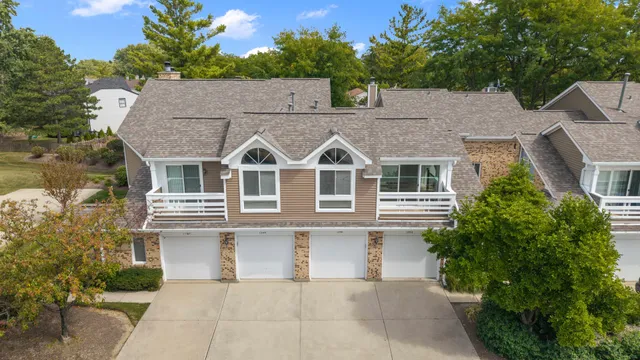 a aerial view of a house with a yard