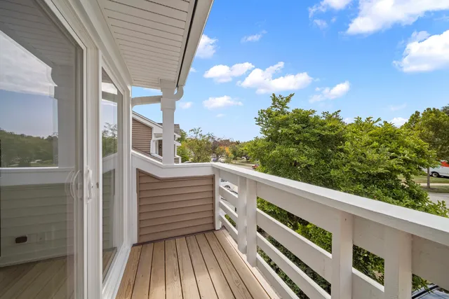 a view of balcony with furniture