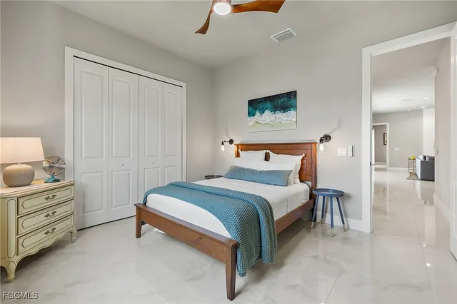 a bedroom with a bed and with furniture