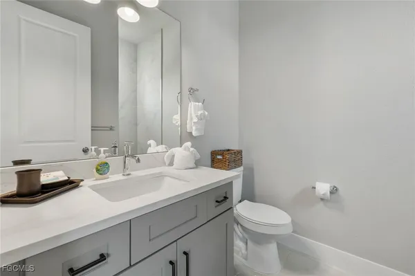 a room with a table and potted plant