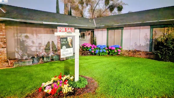 a view of a room with a big yard