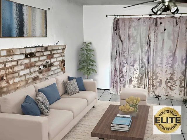 a living room with furniture and a table