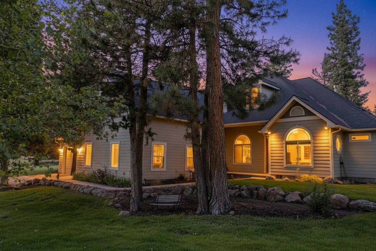 10421 Kestrel Road Klamath Falls, OR 97601 - Photo 1 of 56 a front view of a house with a garden