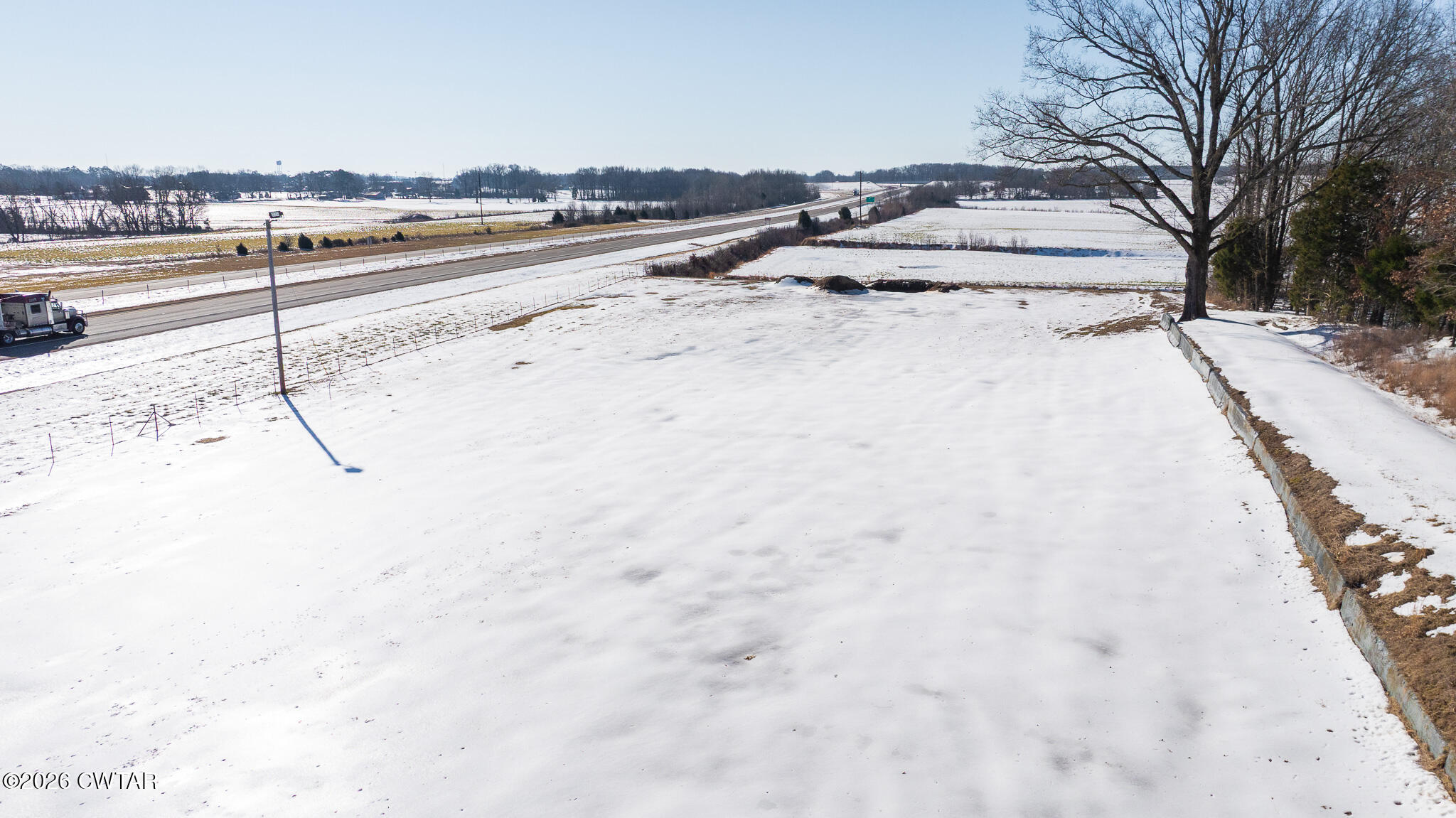 0 Pond Church Road Alamo, TN 38001 - Photo 6 of 18 a view of a road with a snow on the road