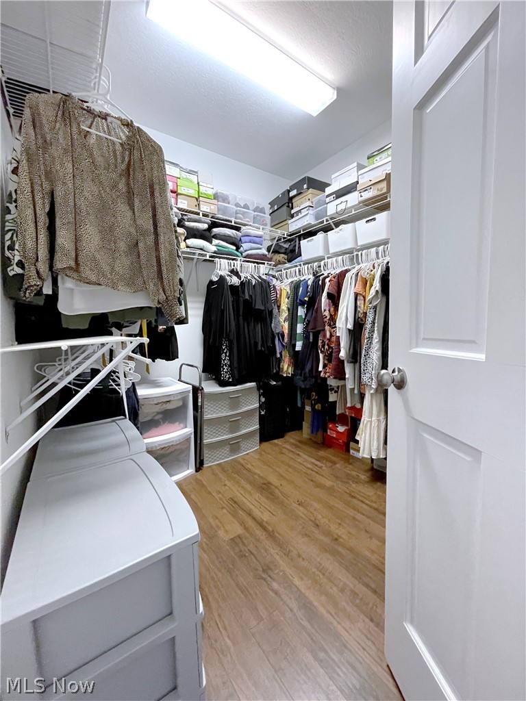 718 Sunridge Road Fairlawn, OH 44333 - Photo 16 of 49 Spacious Master closet with light hardwood / wood-style flooring