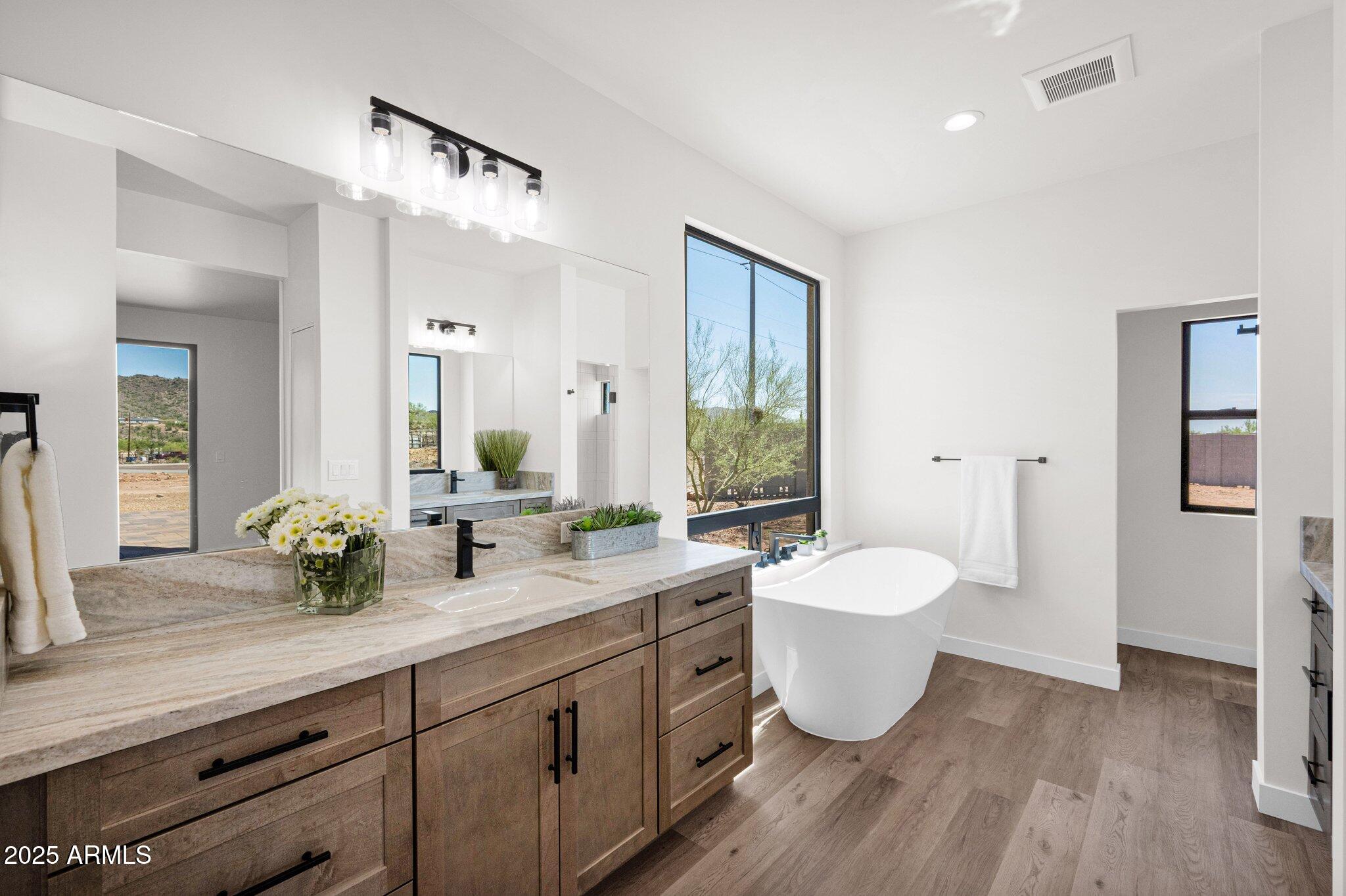 553 West Cavalry Road New River, AZ 85087 - Photo 14 of 26 a bathroom with a double vanity sink and a mirror