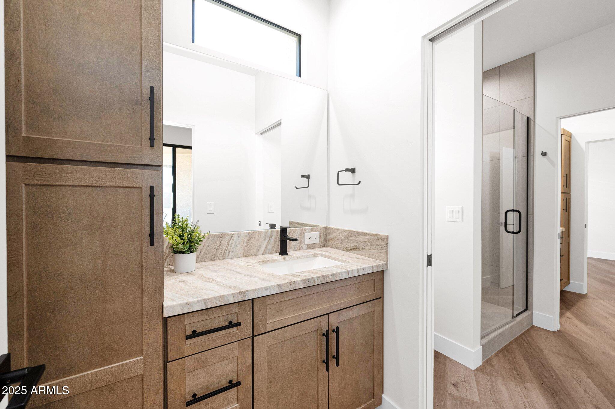 553 West Cavalry Road New River, AZ 85087 - Photo 20 of 26 a bathroom with a granite countertop sink and a mirror