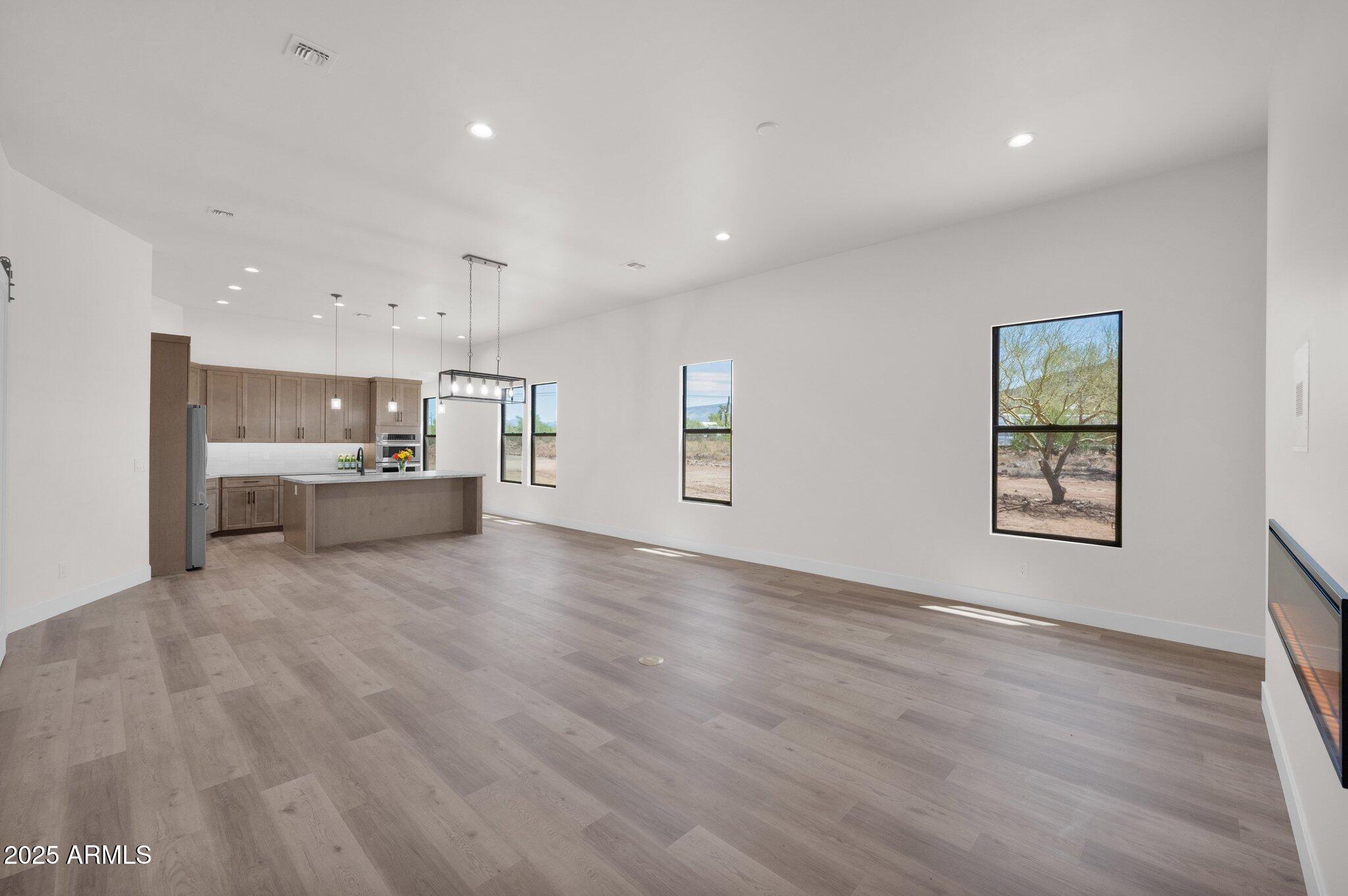 553 West Cavalry Road New River, AZ 85087 - Photo 9 of 26 a view of a kitchen with a sink and a large window