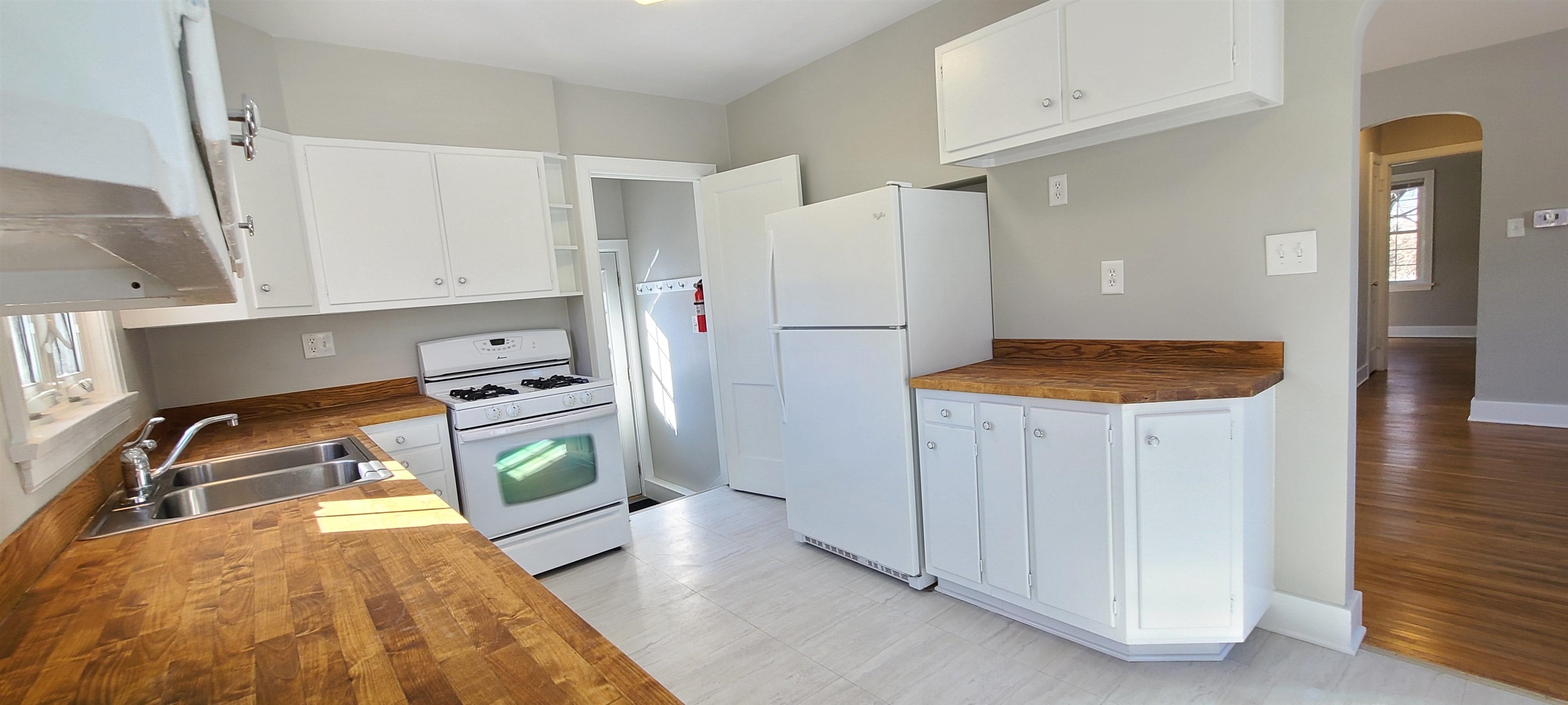 220 South Main Street Rochelle, IL 61068 - Photo 6 of 25 a kitchen with a refrigerator and a stove