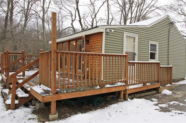 1 East Shore Road Holbrook, MA 02343 - Photo 1 of 16 a side view of a house with a wooden fence