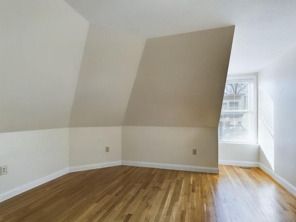 15 Norfolk Street, Unit 2 Boston, MA 02124 - Photo 12 of 14 wooden floor in an empty room