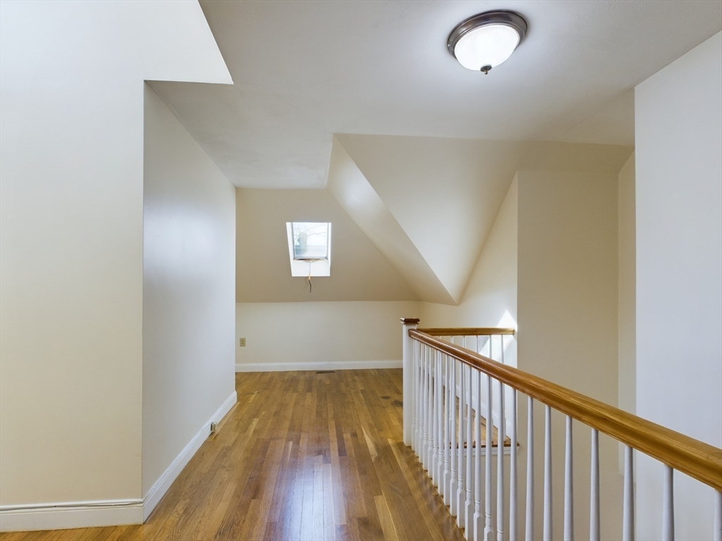 15 Norfolk Street, Unit 2 Boston, MA 02124 - Photo 7 of 14 a view of a hallway with wooden floor