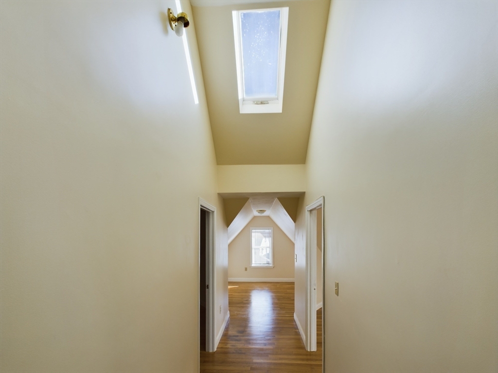 15 Norfolk Street, Unit 2 Boston, MA 02124 - Photo 8 of 14 a view of a hallway with wooden floor and entryway