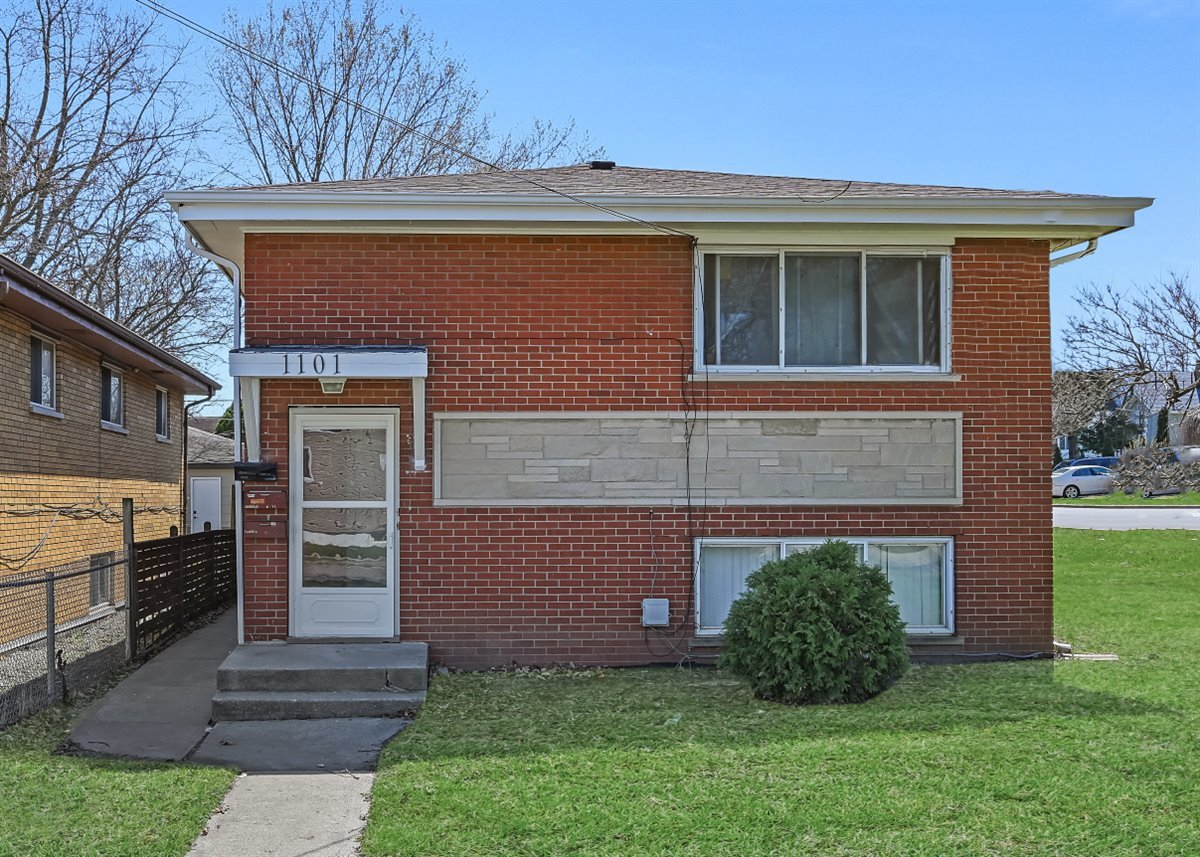 1101 Indian Avenue Aurora, IL 60505 - Photo 1 of 24 a front view of a house with a yard