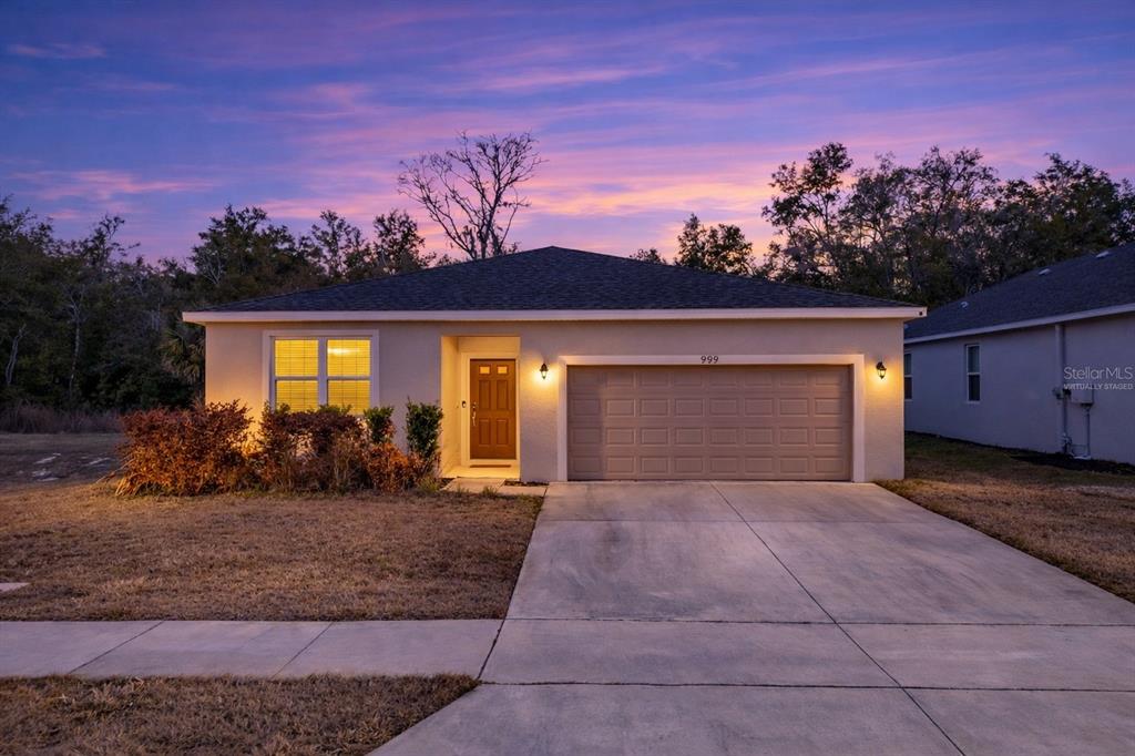 3984 Mayhill Loop Eustis, FL 32736 - Photo 1 of 1 a view of a house with a yard in front of it