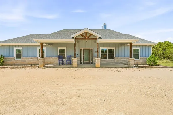 front view of a house with a swimming pool